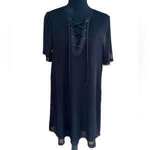 BCBGeneration black lace up front dress with mesh shoulders, relaxed fit size M